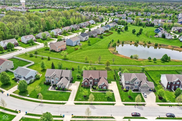 aerial perspective of suburban area with a large body of water