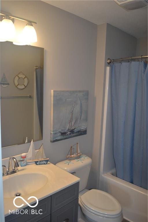 bathroom with toilet, visible vents, shower / tub combo with curtain, and vanity