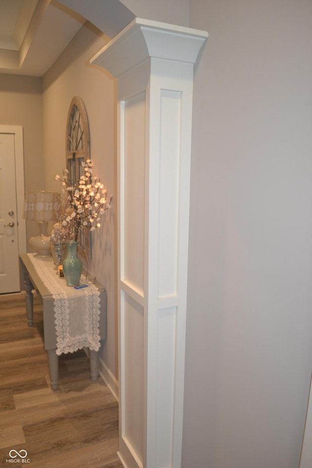 interior space featuring baseboards and wood finished floors