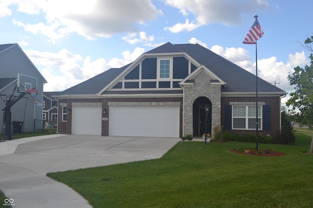 craftsman house featuring a shingled roof, driveway, brick siding, and a front yard