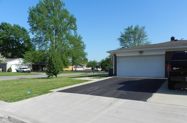 2630 Wedgewood Dr, Columbus, IN 47203 - garage featuring driveway