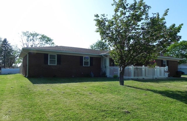 2630 Wedgewood Dr, Columbus, IN 47203 - single story home featuring brick siding, fence, and a front lawn