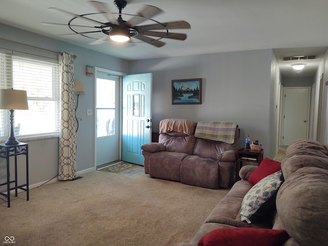 2630 Wedgewood Dr, Columbus, IN 47203 - carpeted living room featuring ceiling fan, visible vents, and baseboards