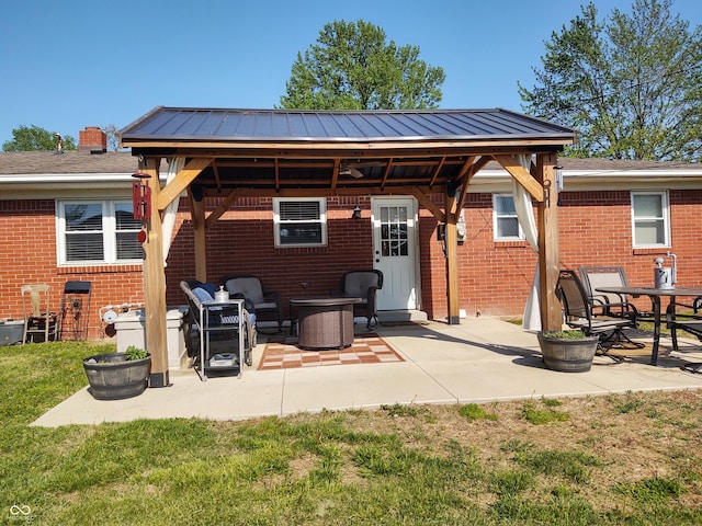 2630 Wedgewood Dr, Columbus, IN 47203 - back of house featuring a gazebo, brick siding, and a patio
