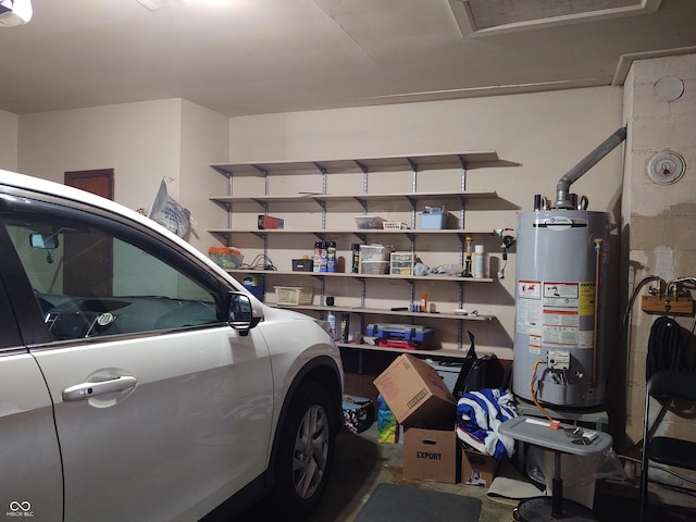 2630 Wedgewood Dr, Columbus, IN 47203 - garage featuring a garage door opener and gas water heater