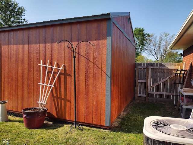 2630 Wedgewood Dr, Columbus, IN 47203 - view of outbuilding featuring central air condition unit, fence, and an outdoor structure