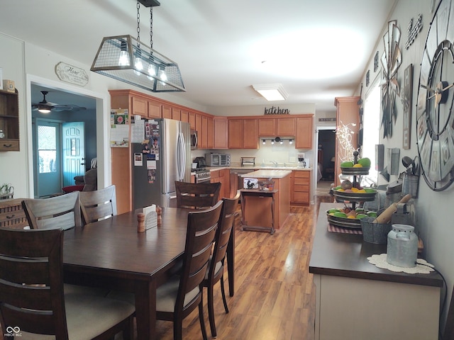 2630 Wedgewood Dr, Columbus, IN 47203 - dining space with light wood-style floors and ceiling fan