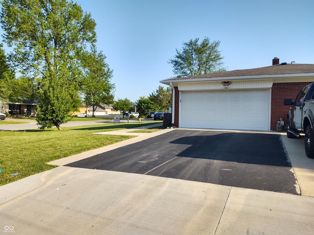 2630 Wedgewood Dr, Columbus, IN 47203 - garage with aphalt driveway