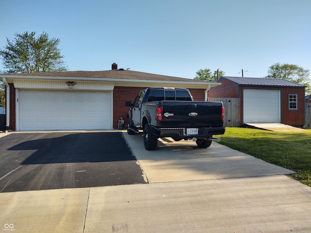 2630 Wedgewood Dr, Columbus, IN 47203 - ranch-style house featuring brick siding and aphalt driveway
