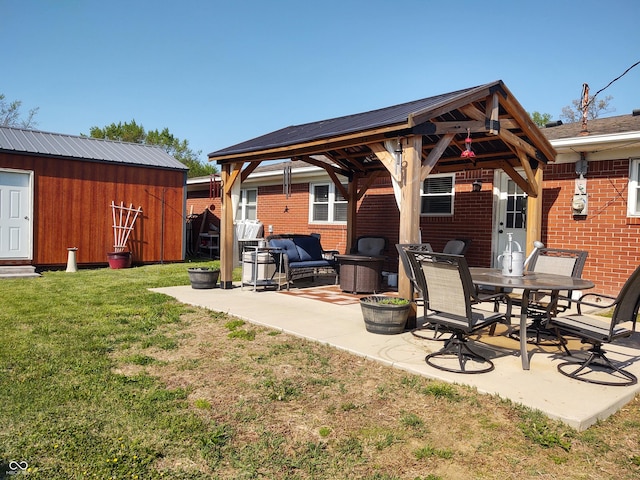 2630 Wedgewood Dr, Columbus, IN 47203 - exterior space with metal roof, a patio area, brick siding, a gazebo, and a yard