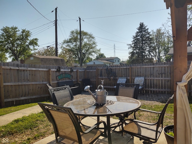 2630 Wedgewood Dr, Columbus, IN 47203 - view of patio / terrace with a fenced backyard and outdoor dining space