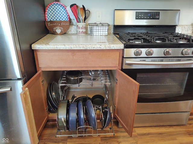2630 Wedgewood Dr, Columbus, IN 47203 - kitchen with light countertops, appliances with stainless steel finishes, and wood finished floors