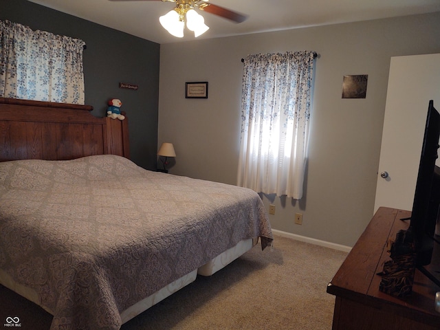 2630 Wedgewood Dr, Columbus, IN 47203 - bedroom with carpet flooring, a ceiling fan, and baseboards