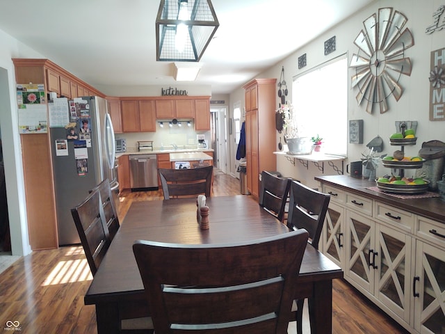 2630 Wedgewood Dr, Columbus, IN 47203 - dining space featuring a toaster and dark wood-style floors