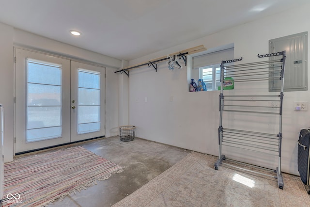 garage with french doors and electric panel