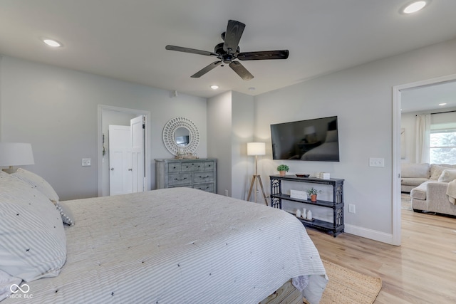 bedroom with recessed lighting, baseboards, and wood finished floors