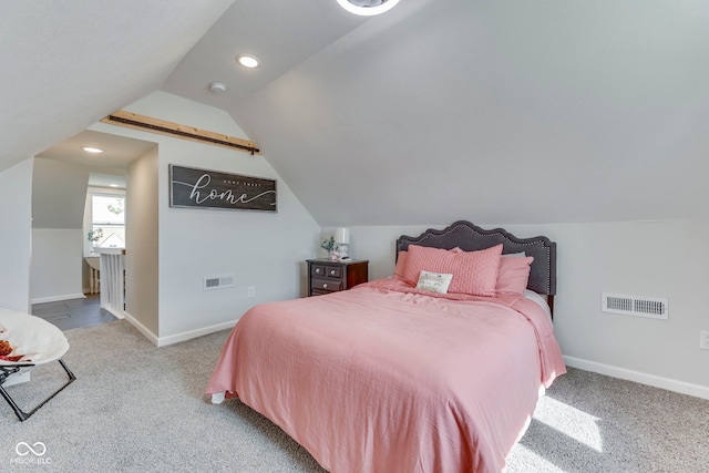 carpeted bedroom featuring baseboards, visible vents, and vaulted ceiling