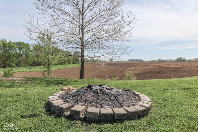 view of yard with an outdoor fire pit