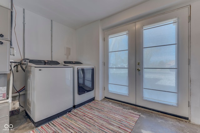 clothes washing area featuring independent washer and dryer and french doors