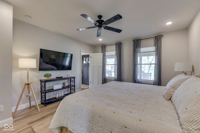 bedroom featuring baseboards, recessed lighting, light wood-style flooring, and a ceiling fan