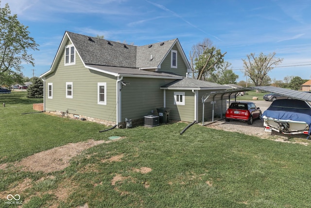 exterior space featuring a shingled roof, a yard, and central AC unit