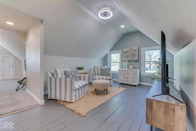 bedroom with baseboards, vaulted ceiling, and hardwood / wood-style floors