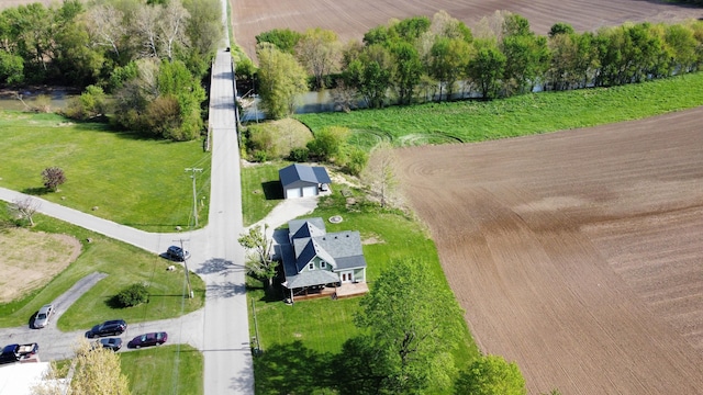 birds eye view of property with a rural view