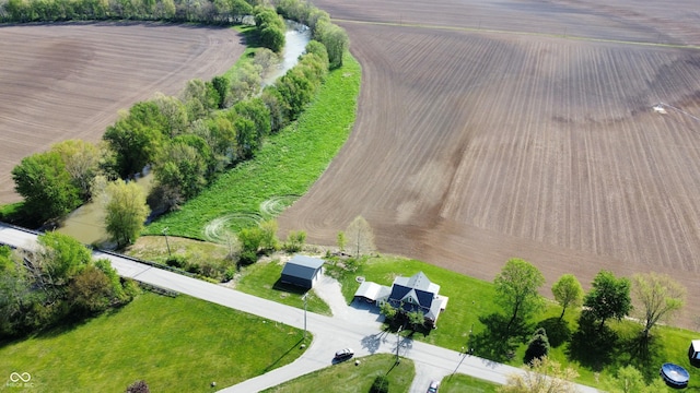 birds eye view of property with a rural view