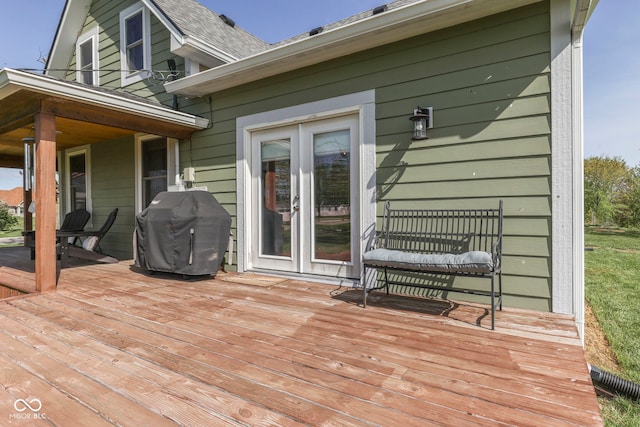 wooden terrace featuring grilling area and french doors