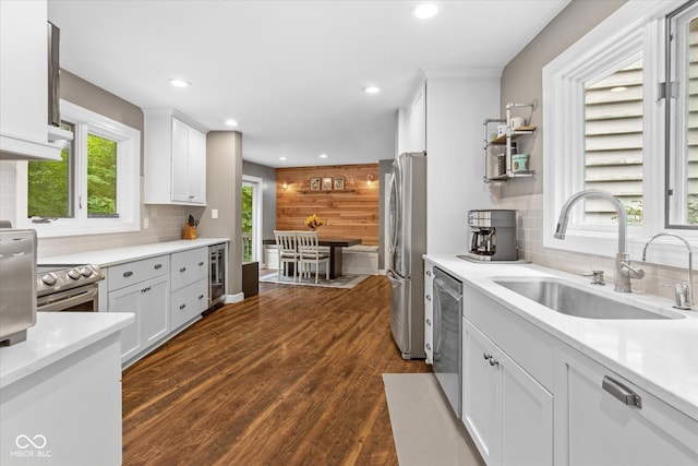 2450 S US-421, Zionsville, IN 46077 - kitchen featuring backsplash, stainless steel appliances, white cabinets, and a sink