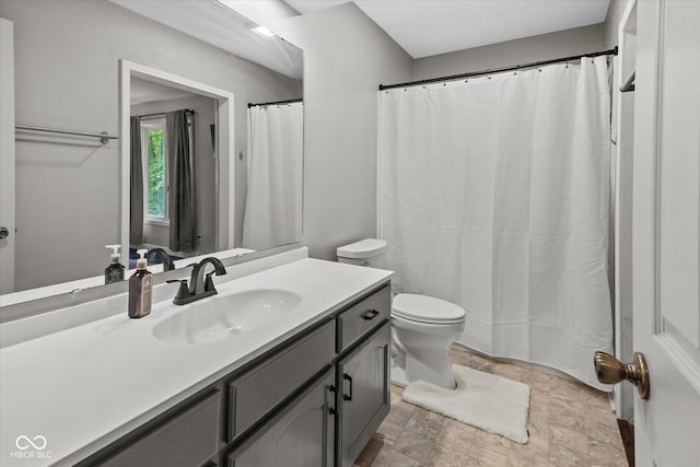 2450 S US-421, Zionsville, IN 46077 - full bathroom with vanity, toilet, stone finish flooring, and a shower with shower curtain