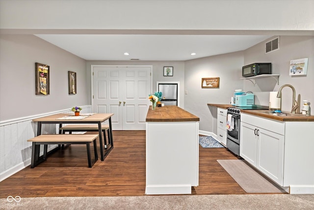 2450 S US-421, Zionsville, IN 46077 - kitchen with black microwave, a sink, recessed lighting, visible vents, and butcher block counters