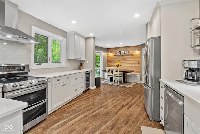 2450 S US-421, Zionsville, IN 46077 - kitchen with beverage cooler, recessed lighting, wall chimney exhaust hood, and stainless steel appliances