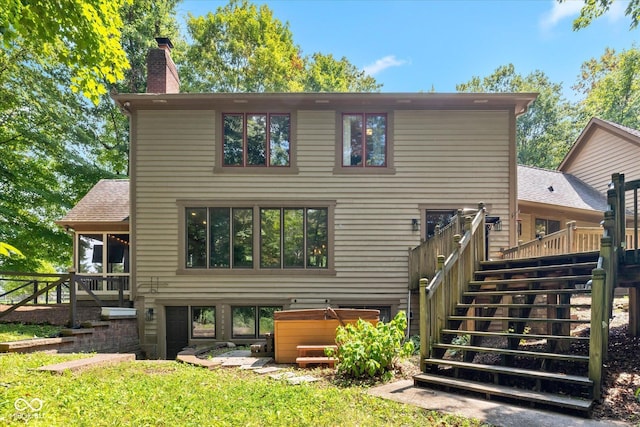 2450 S US-421, Zionsville, IN 46077 - back of house featuring a hot tub, a deck, a chimney, and stairs
