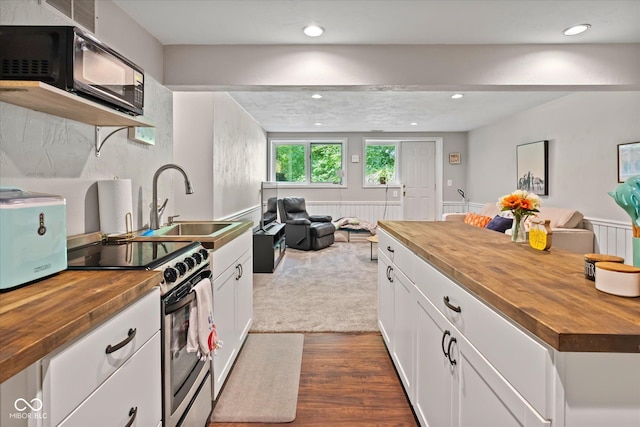 2450 S US-421, Zionsville, IN 46077 - kitchen featuring electric range, open floor plan, and butcher block counters