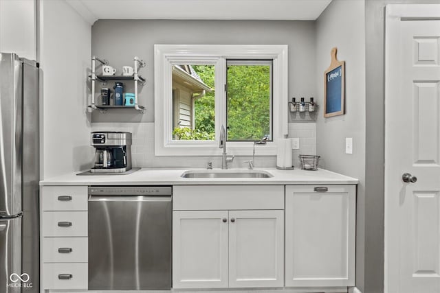 2450 S US-421, Zionsville, IN 46077 - kitchen with a sink, white cabinets, tasteful backsplash, and stainless steel appliances