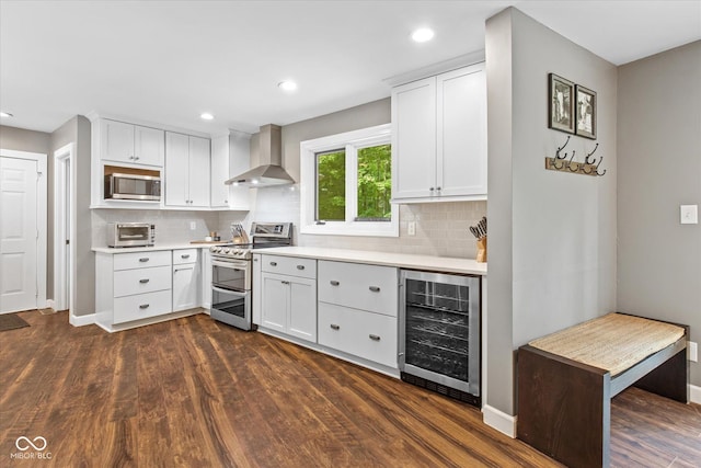 2450 S US-421, Zionsville, IN 46077 - kitchen with light countertops, stainless steel appliances, wall chimney exhaust hood, and wine cooler