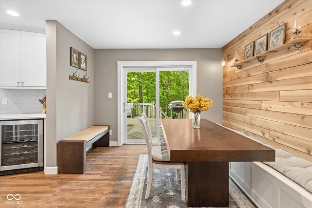 2450 S US-421, Zionsville, IN 46077 - dining room featuring a bar, recessed lighting, beverage cooler, wooden walls, and wood finished floors