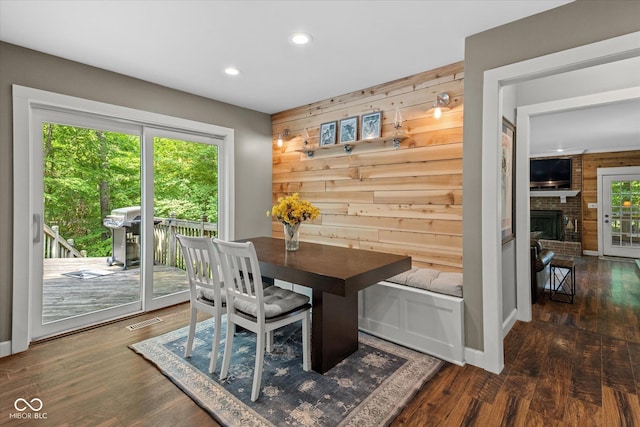 2450 S US-421, Zionsville, IN 46077 - dining area featuring wooden walls, a fireplace, recessed lighting, wood finished floors, and visible vents