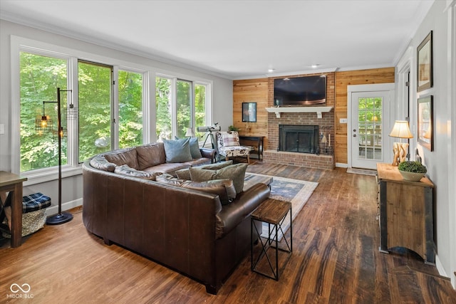 2450 S US-421, Zionsville, IN 46077 - living room featuring crown molding, a brick fireplace, and wood finished floors