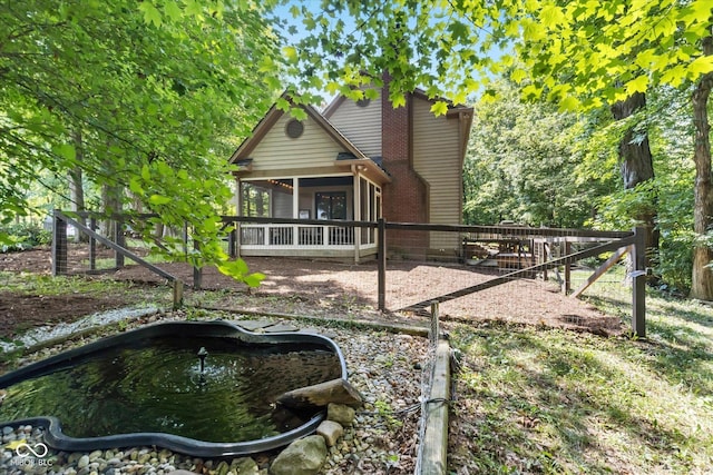 2450 S US-421, Zionsville, IN 46077 - rear view of house featuring a sunroom