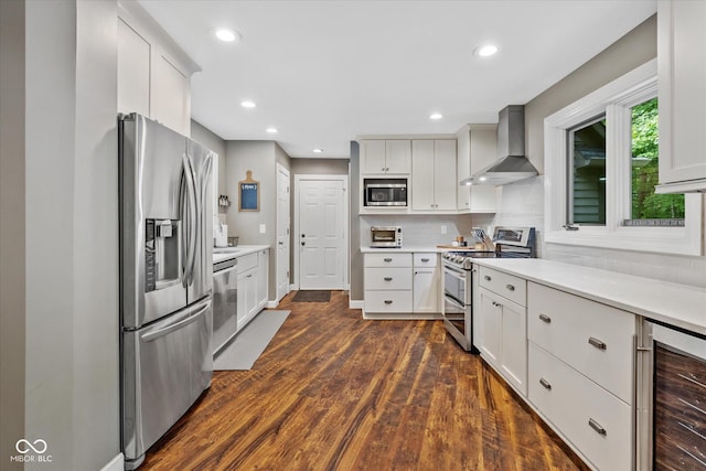 2450 S US-421, Zionsville, IN 46077 - kitchen with wine cooler, dark wood-style floors, wall chimney range hood, light countertops, and stainless steel appliances