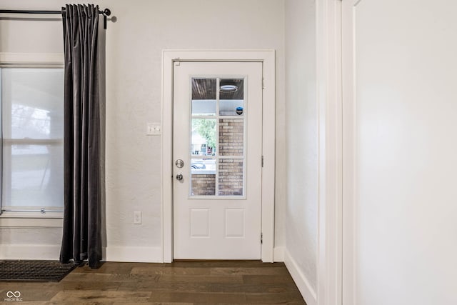 1451 N Grant Ave, Indianapolis, IN 46201 - entryway with dark wood-style floors and baseboards