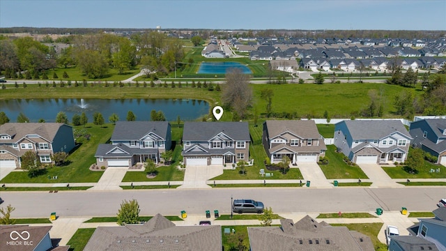 bird's eye view with a water view and a residential view