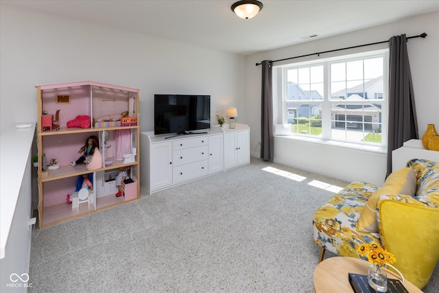 recreation room featuring visible vents and carpet