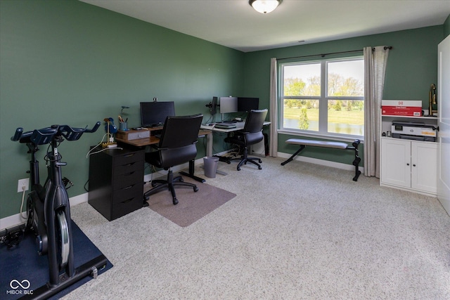 home office featuring baseboards and carpet floors