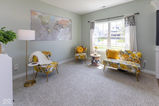 sitting room with baseboards, carpet, and visible vents