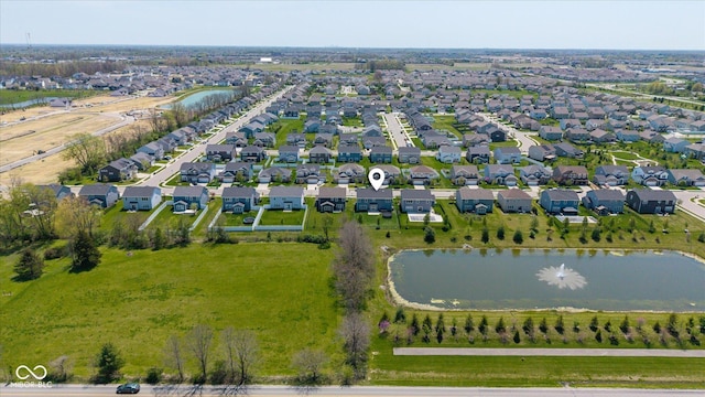 aerial view featuring a water view and a residential view