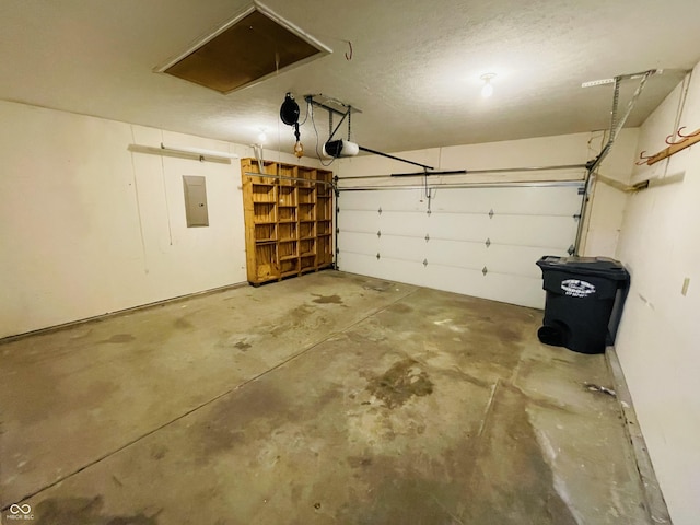 garage featuring a garage door opener and electric panel