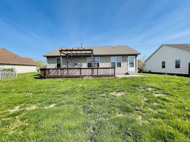 back of house featuring a yard, a pergola, and a wooden deck